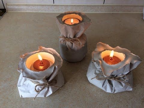 Voile Lumière Concrete Tealight Trio — hand-poured concrete holders with fabric voile wrap and jute twine, lit with warm amber tealights
