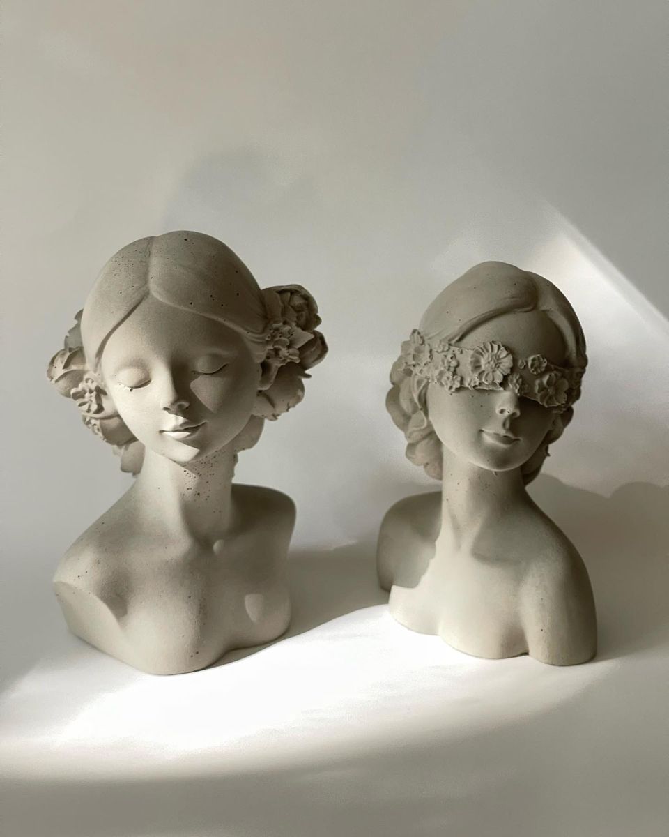 Qolachi Venus and Muse sculptural bust candles in warm ivory soy wax with floral detailing