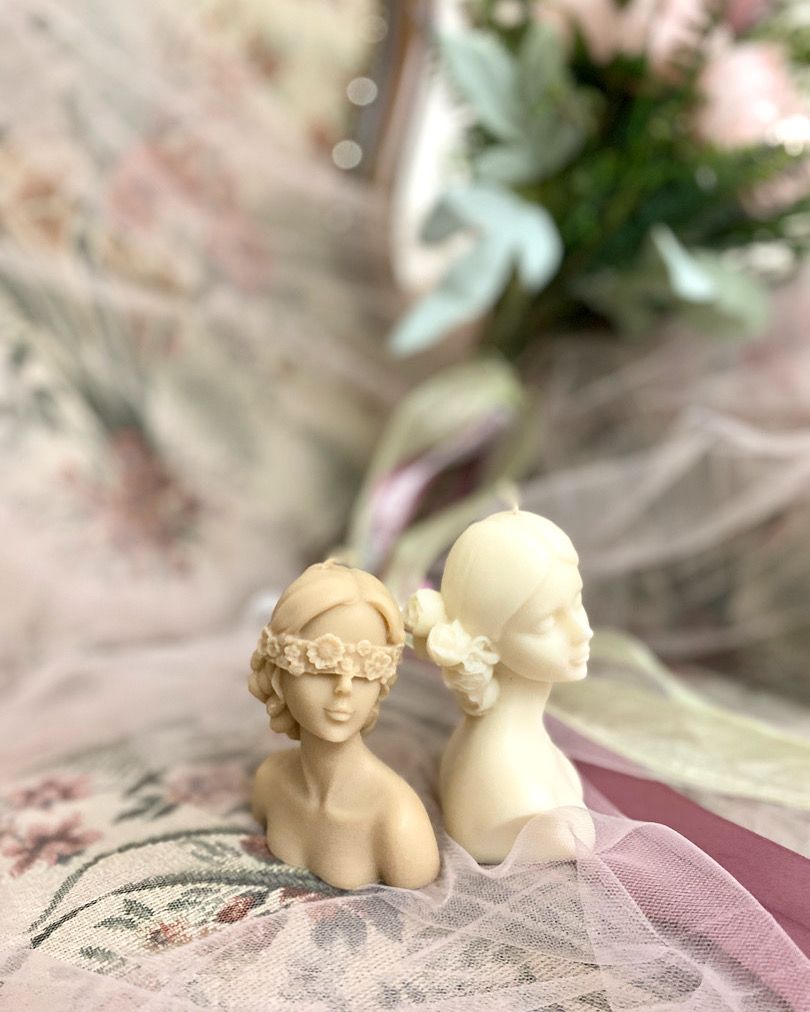 Qolachi Venus and Muse sculptural bust candles on woven tray lifestyle