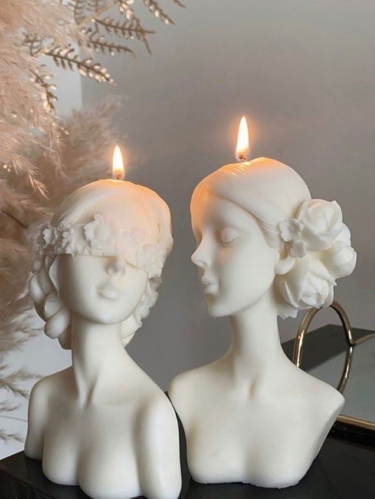 Qolachi Venus and Muse sculptural bust candles with floral blindfold detail