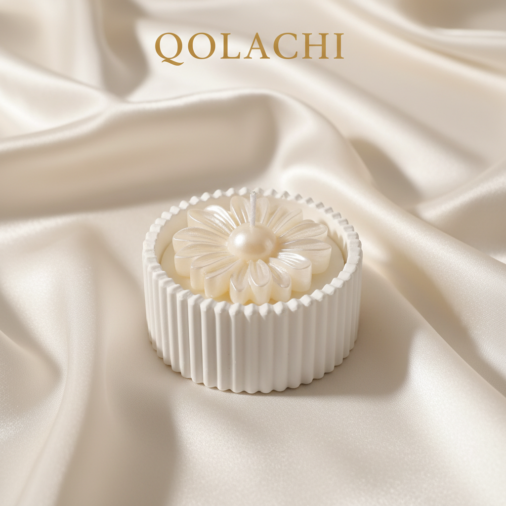 Qolachi Dahlia Lumière candle vessel in ivory pearl metallic white on cream silk background