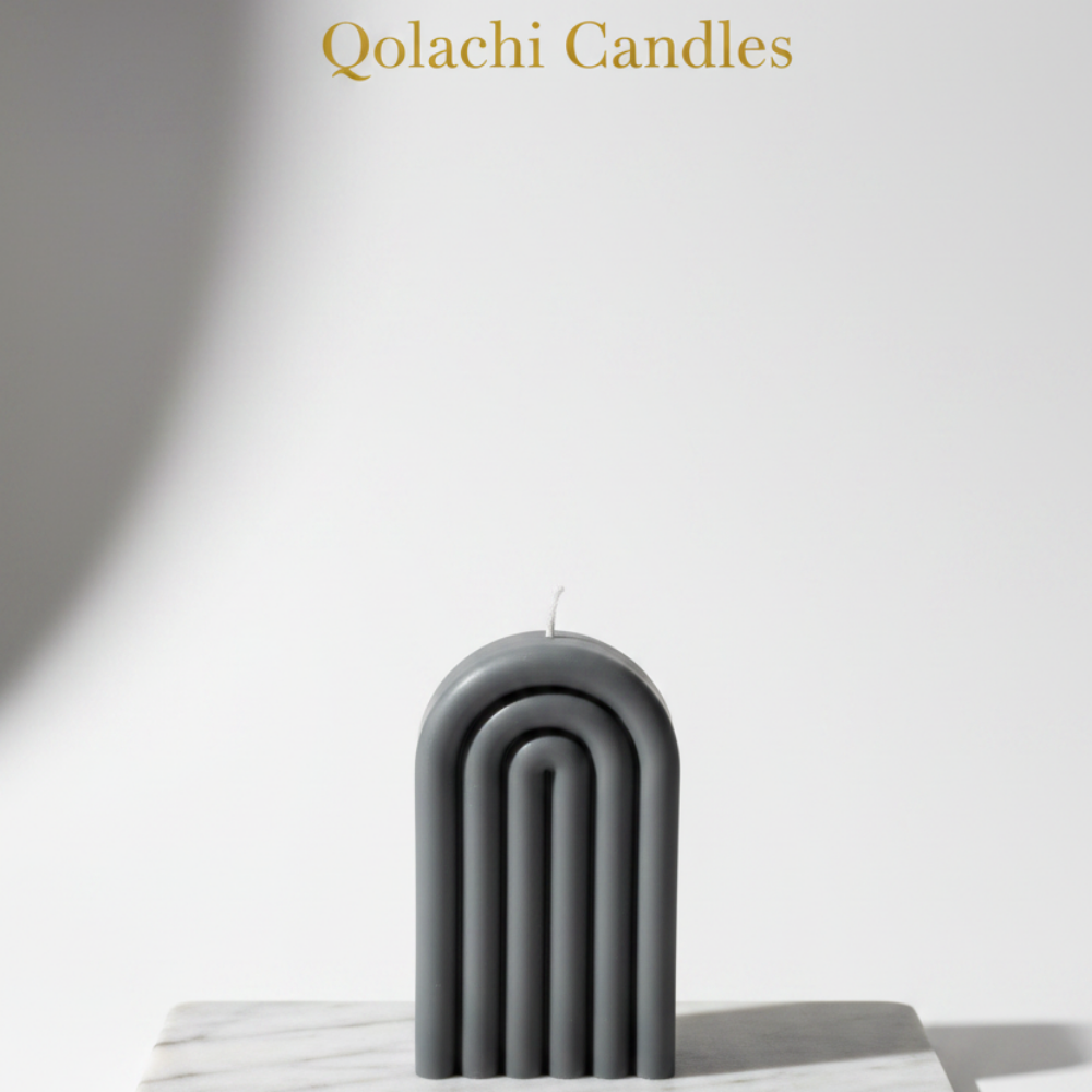 Arcadia Arch Candle — Charcoal Mist on marble slab