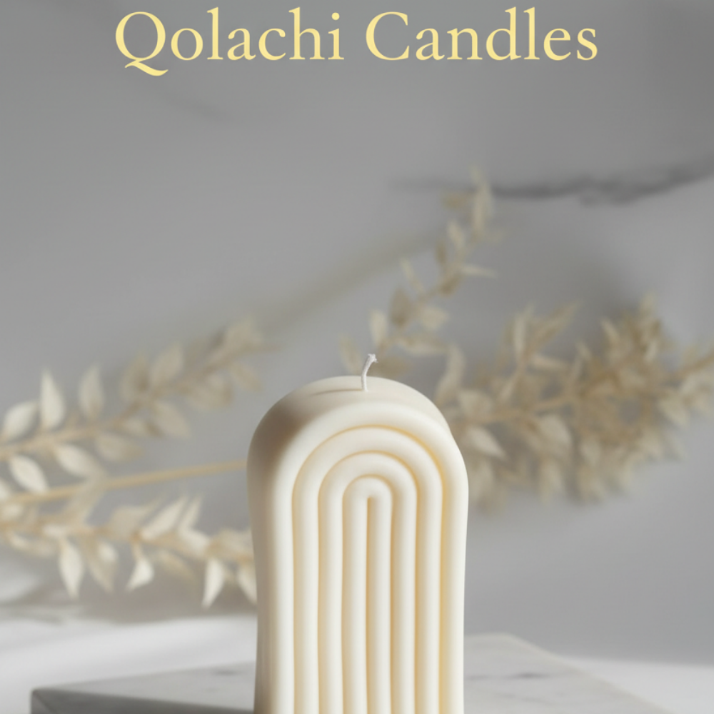 Arcadia Arch Candle — Ivory Blanc on marble surface