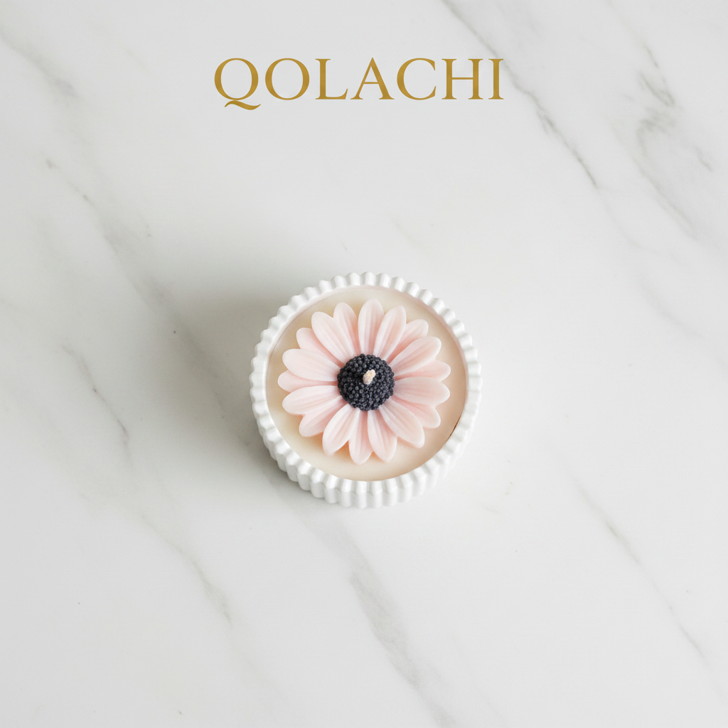 Qolachi Dahlia Lumière candle vessel in blush pink on cream marble background