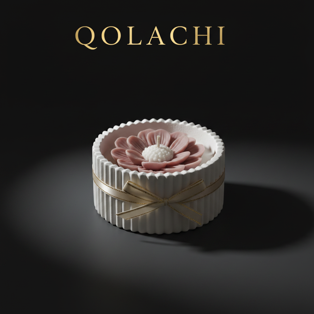 Qolachi Dahlia Lumière candle vessel in dusty rose on dark charcoal background